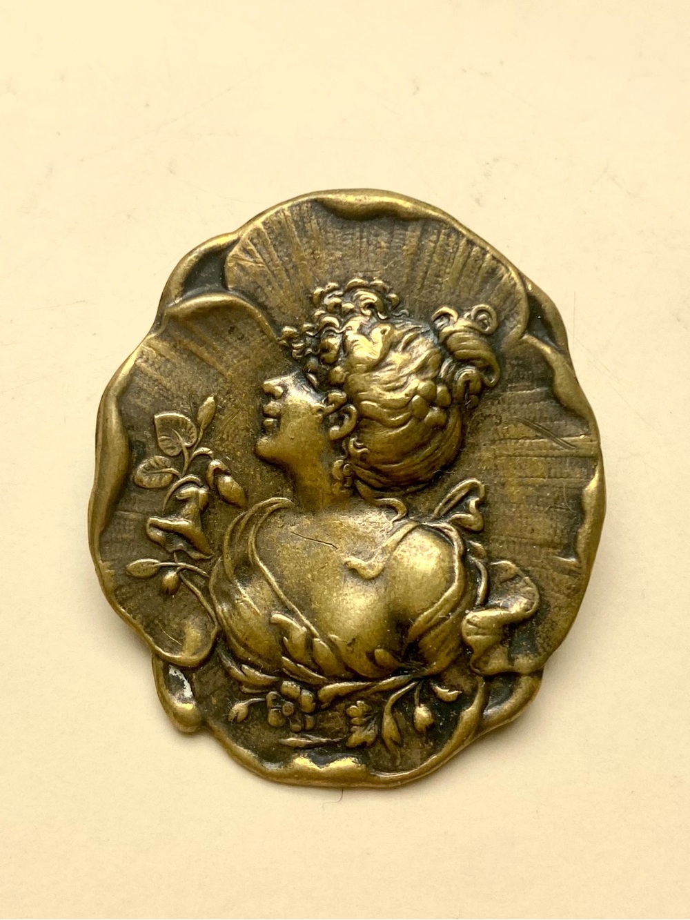 Vintage brass floral carved portrait brooch